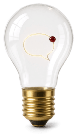 A clear light bulb on a brass base, its filament bent into the shape of a speech bubble